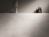 Maxim�ln� minimalistick� je oblo�iteln� ovl�dac� deska Visign for Style 22, kter� se dokonale za�le�uje do obkladu a podtrhuje harmonick�, modern� design koupelny. (foto: Viega)